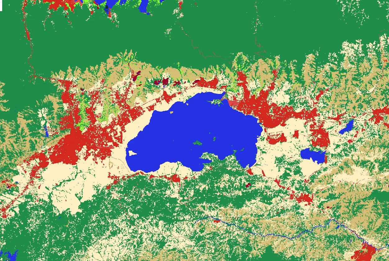 Mapa de cobertura del suelo alrededor de un lago en Venezuela: bosques, sabanas, agua y áreas antrópicas en distintos colores.